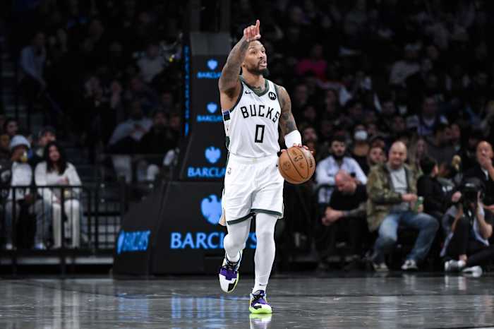 Milwaukee Bucks guard Damian Lillard (0) sets the play 